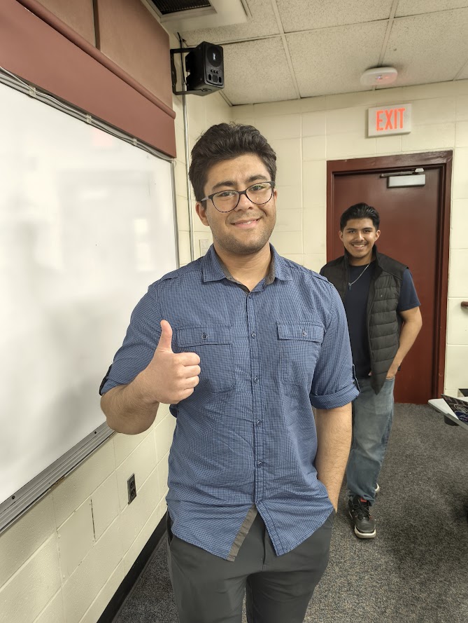 A successful test take gives a thumbs up with the President behind him